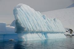 15E Iceberg Shaped Like A Pipe Organ Next To Cuverville Island From Zodiac On Quark Expeditions Antarctica Cruise